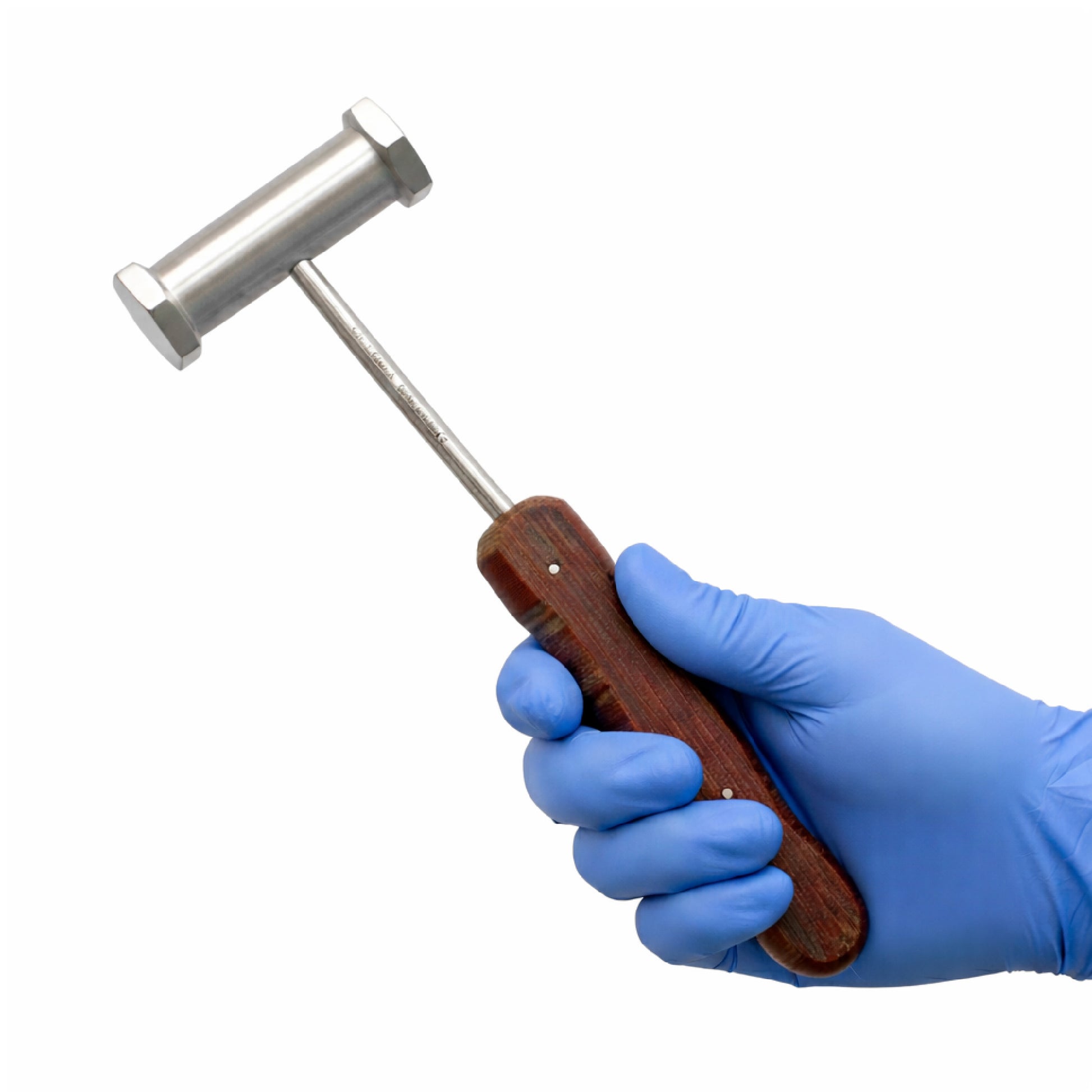 Hand holding a metal mallet with a wooden handle, wearing a blue glove on a white background