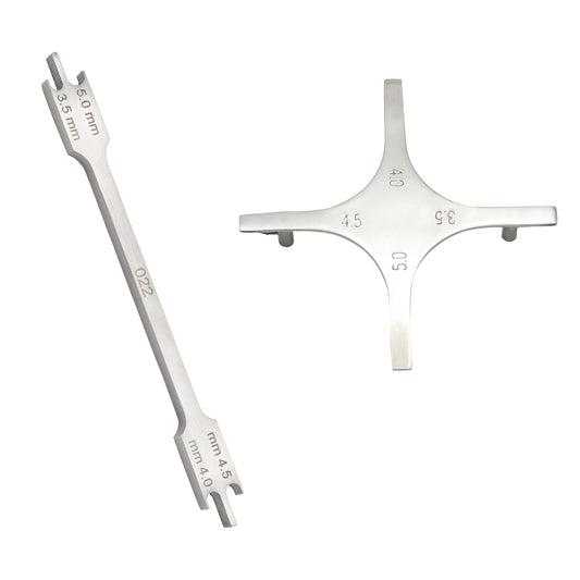 Metal tool with measurement markings on a white background
