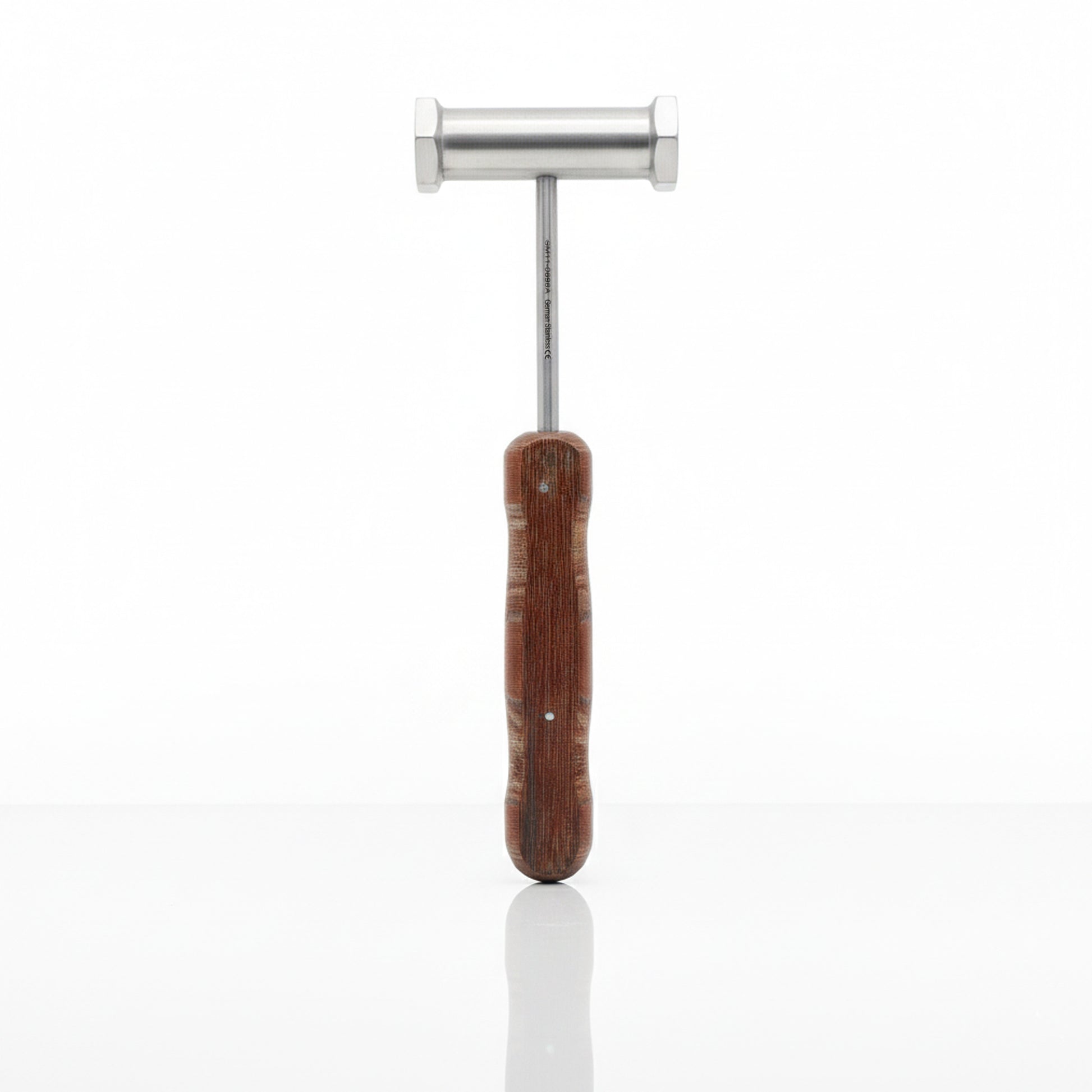 Metal tool with wooden handle on a white background