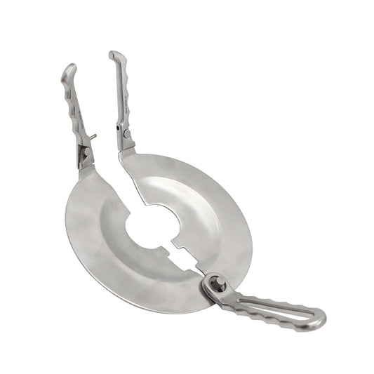 Metallic camping stove with a carabiner on a white background