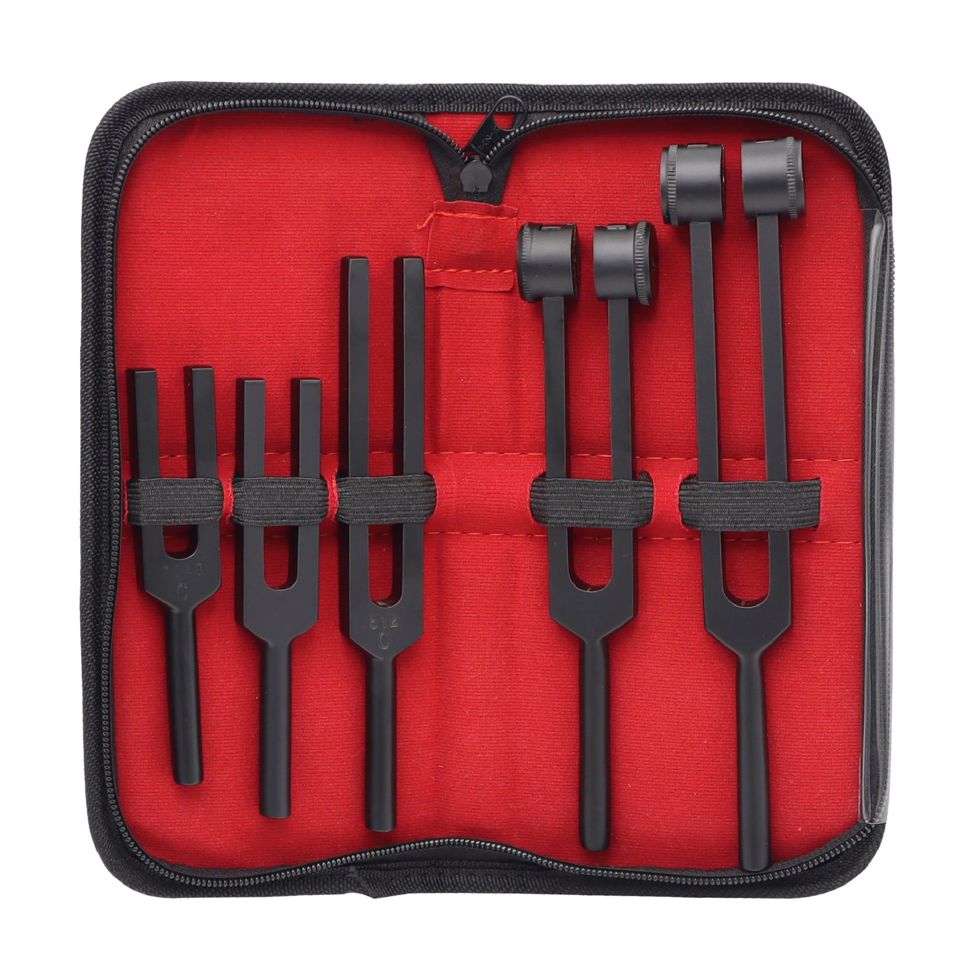 Set of black tuning forks in a red case on a white background