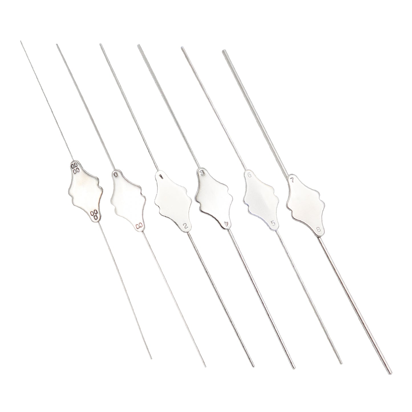 Set of five silver skewers with decorative ends on a white background