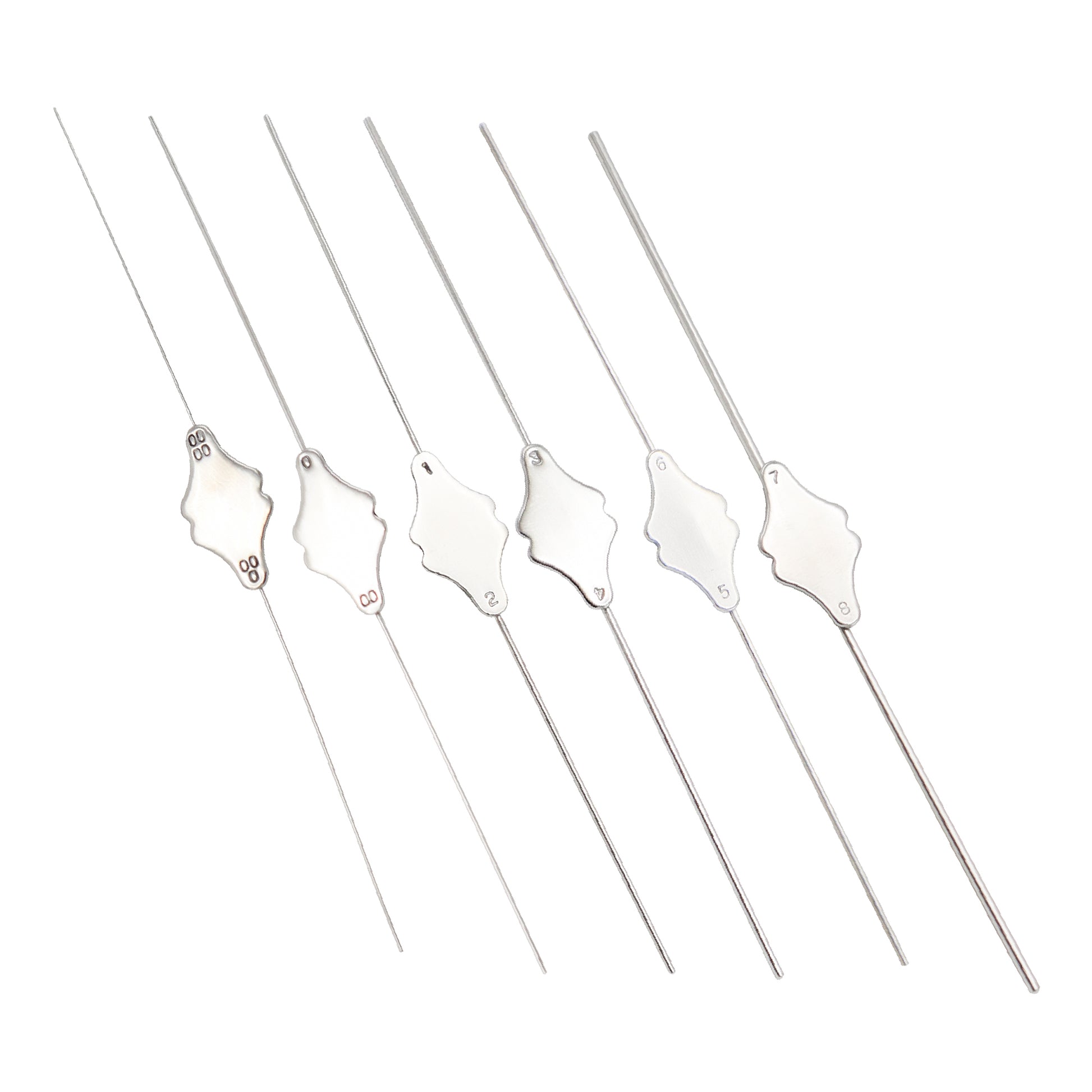 Set of five silver skewers with decorative ends on a white background