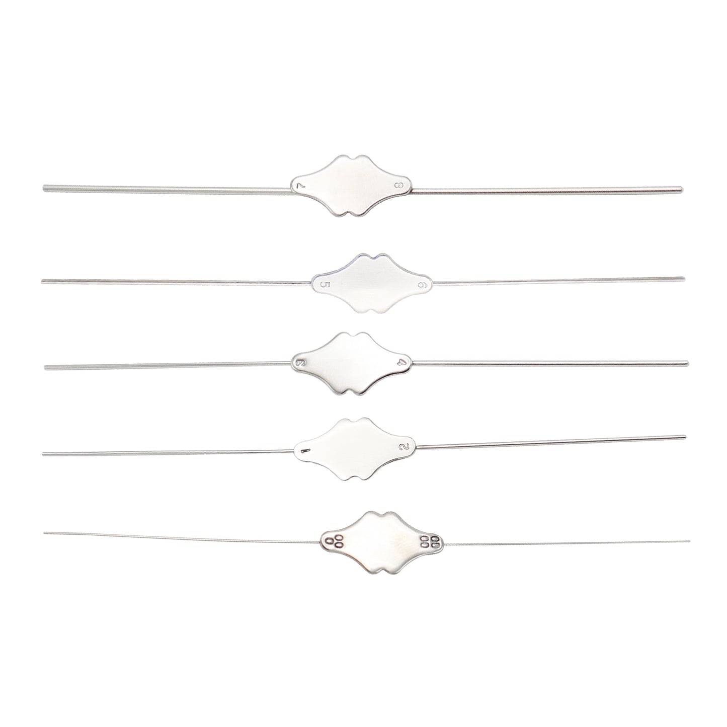 Set of five white hair ties with decorative ends on a white background