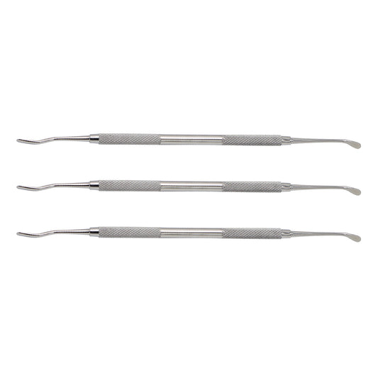Set of three metal dental tools on a white background