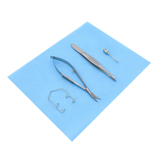 A Sub-Tenon Lite Kit with a blue lid, containing a speculum, forceps, cannula, and scissors for ophthalmic procedures.