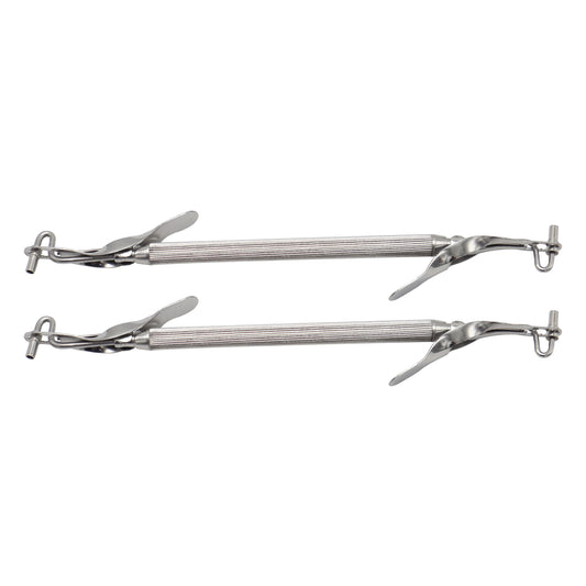 Two pairs of metal tongs on a white background