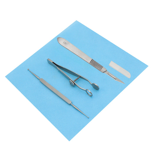 A chalazion procedure kit on a blue sterile pad, including various medical instruments such as a lid clamp, curette, scalpel, and scissors.