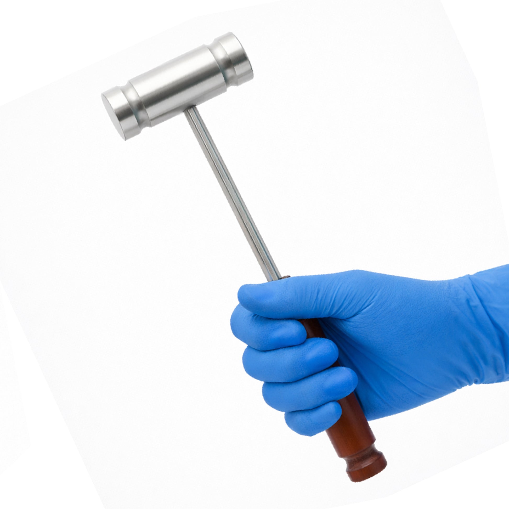 A gloved hand securely grips a Dejerine-style neurological reflex hammer featuring a cylindrical steel head and a contoured brown wood handle.