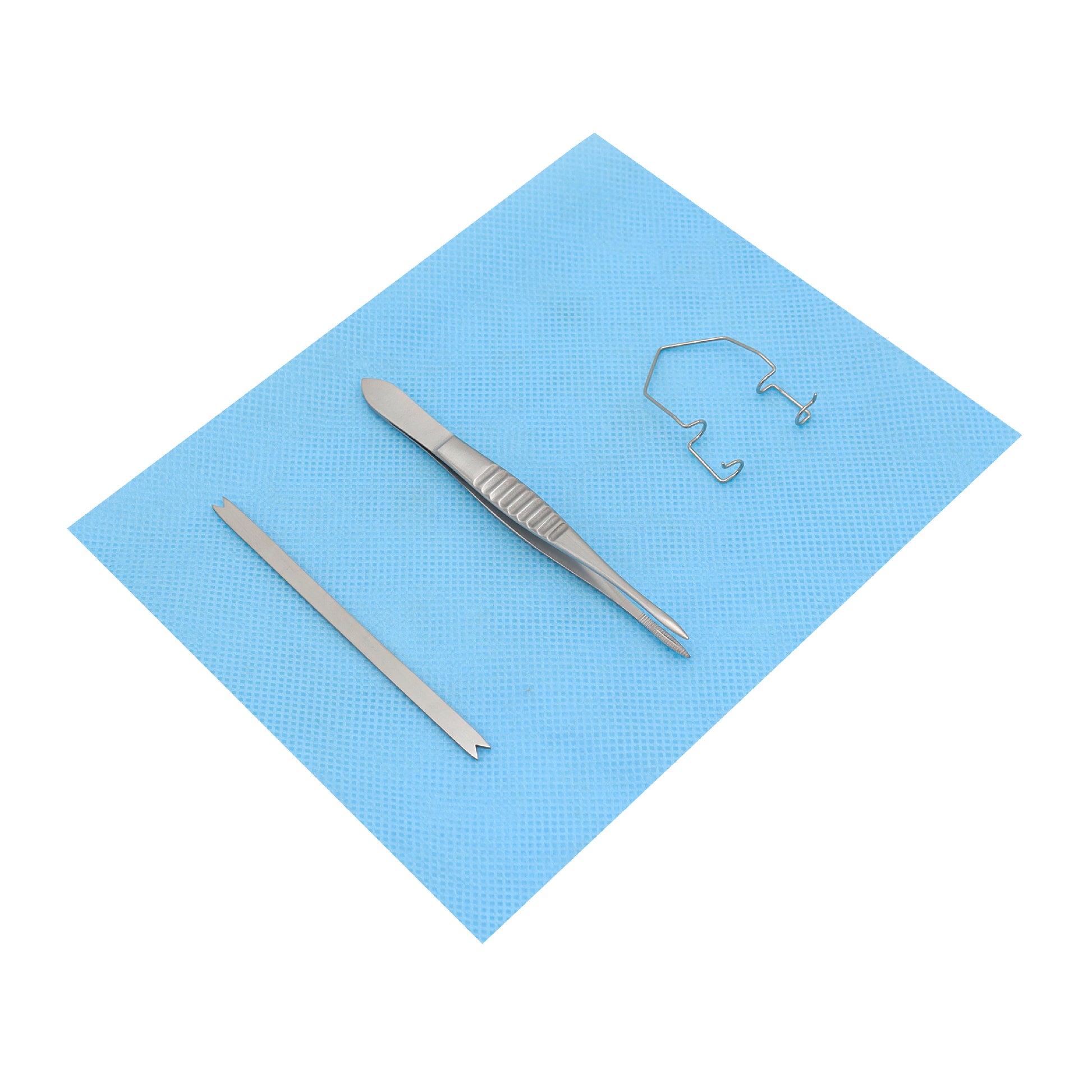 An intravitreal lite procedure kit with a lid speculum, Moorfield forceps, and Braunstein calipers on a blue surgical pad.