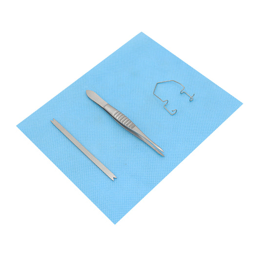 An intravitreal lite procedure kit with a lid speculum, Moorfield forceps, and Braunstein calipers on a blue surgical pad.