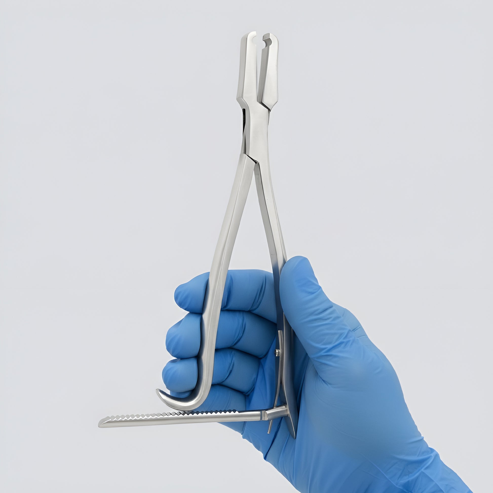 Kern bone holding forceps with ratchet lock made of surgical stainless steel, held by a gloved hand against a plain background.