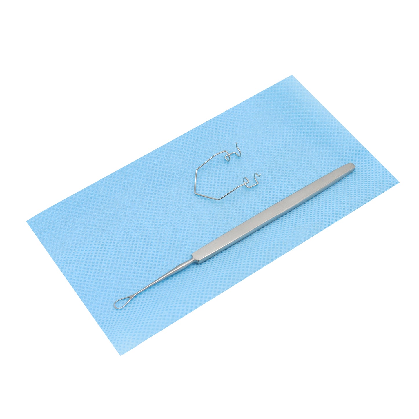 A neonatal examination set consisting of a speculum and a wire vectis on a blue sterile pad.