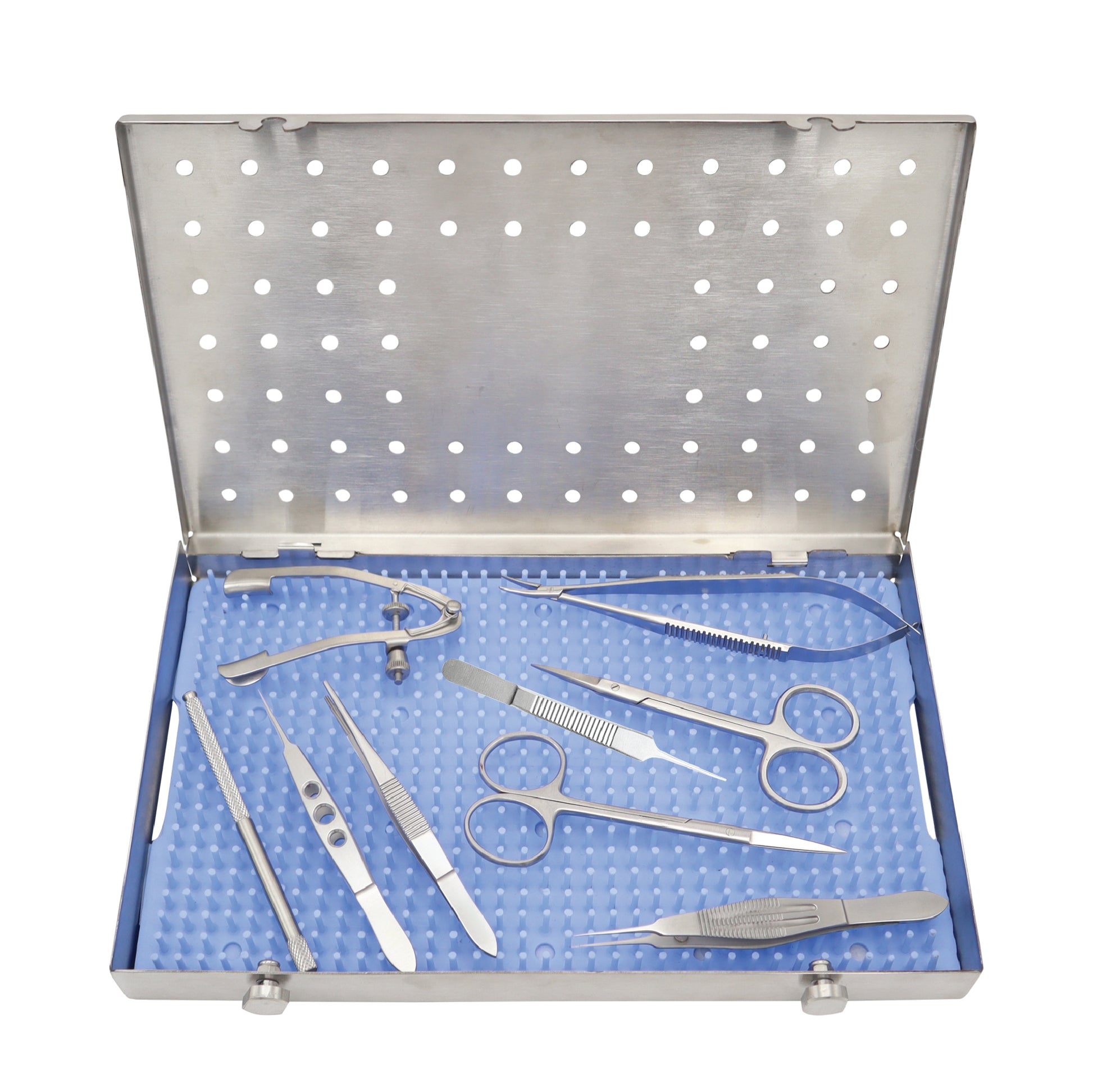 An open surgical instrument tray containing various ophthalmic instruments such as scissors, forceps, and a speculum.