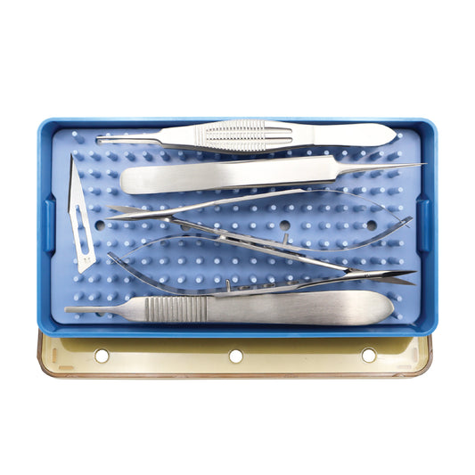 A blue sterilization tray containing a specialized set of stainless steel ophthalmic surgical instruments, including micro-forceps, fine-tipped scissors, and scalpel handles.