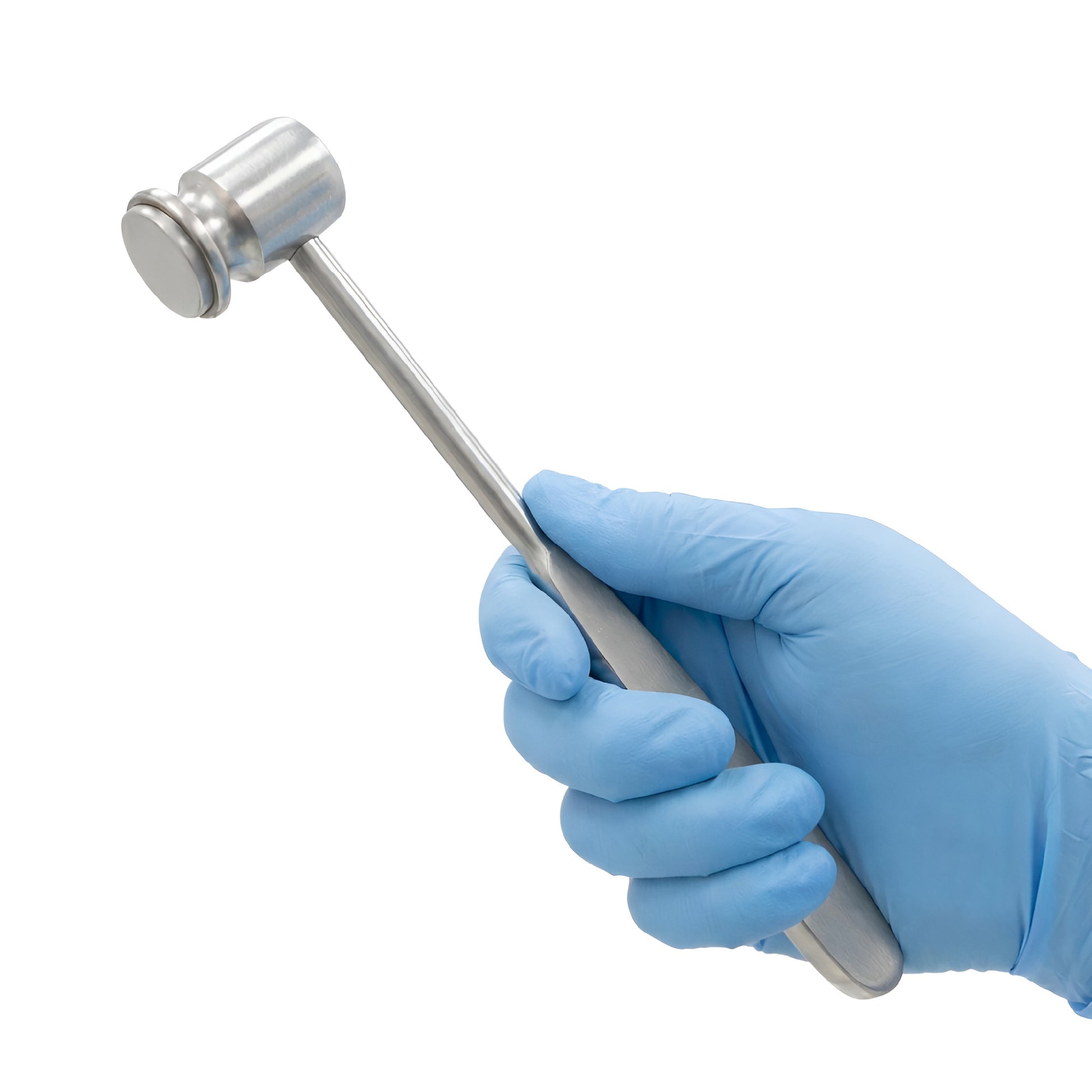 A heavy metal orthopedic bone mallet surgical hammer made of stainless steel with a flat cylindrical head, being held by a hand in a blue latex glove over a white background.
