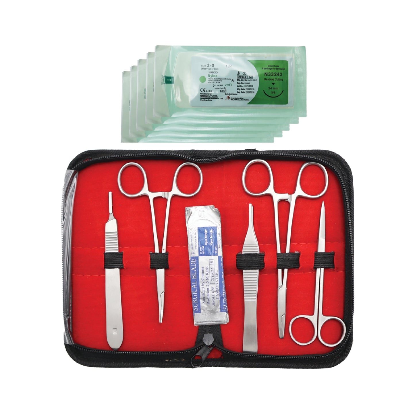 SM Student Practice Complete Suture Kit arranged on a clean surface, showing surgical practice tools including forceps, scissors, needle holder, suture threads, and synthetic skin pads for training medical stitching skills.